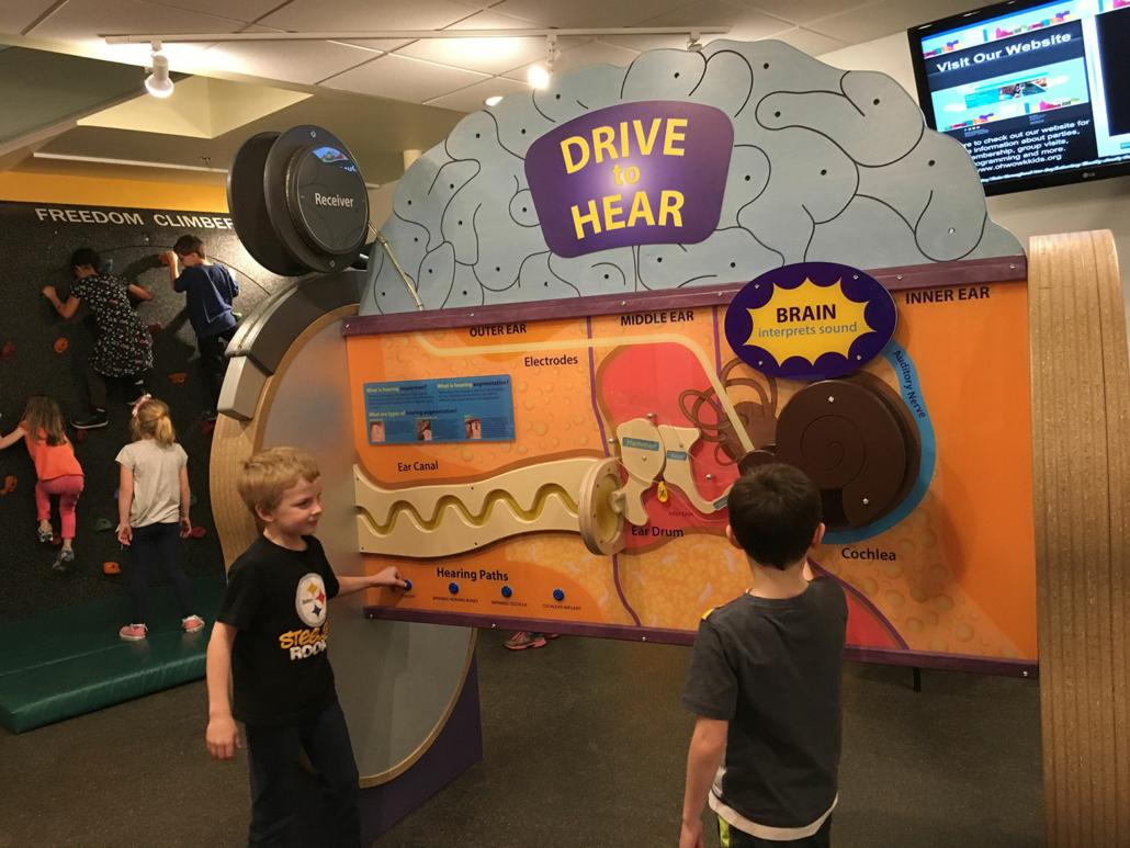 Children interacting at an exhibit at the OH WOW! Science Center.