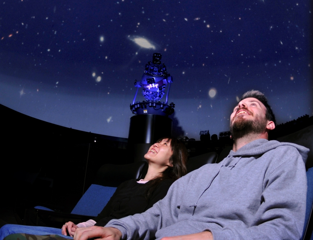 Visitors watching a show at the Ward Beecher Planetarium.